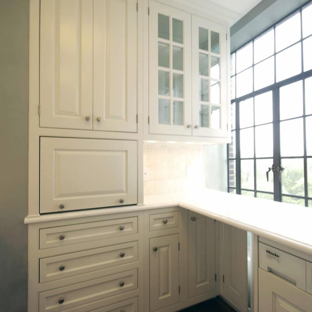 blind corner cabinets and custom shelves maximize storage in small spaces
