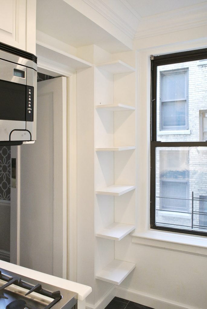 A blind corner cabinet or custom shelves maximize storage in small spaces