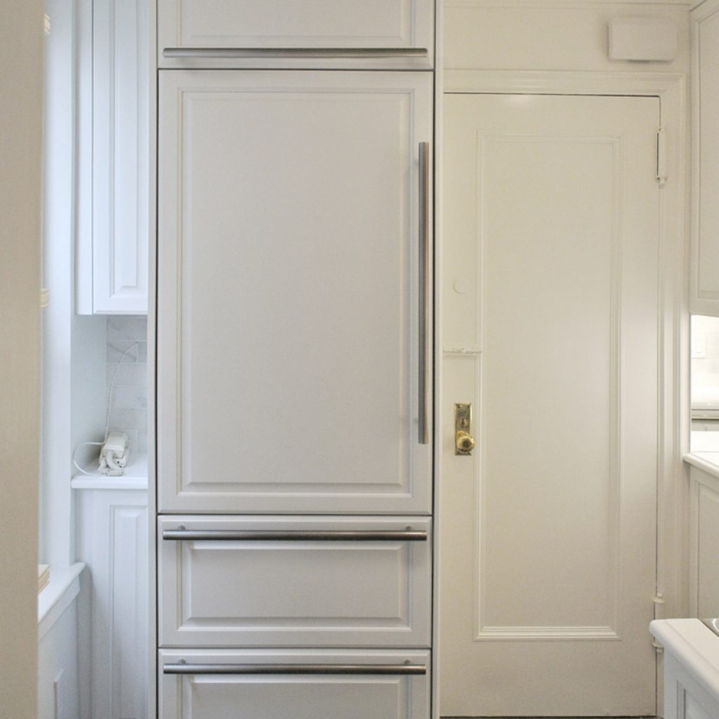 A blind corner cabinet maximizes storage in small NYC apartments