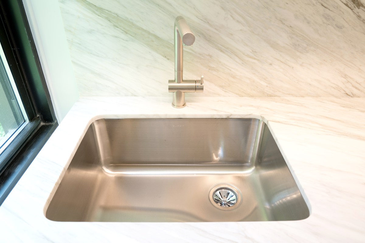 NYC prewar kitchen renovation featuring custom sink basin and faucet, chrome color