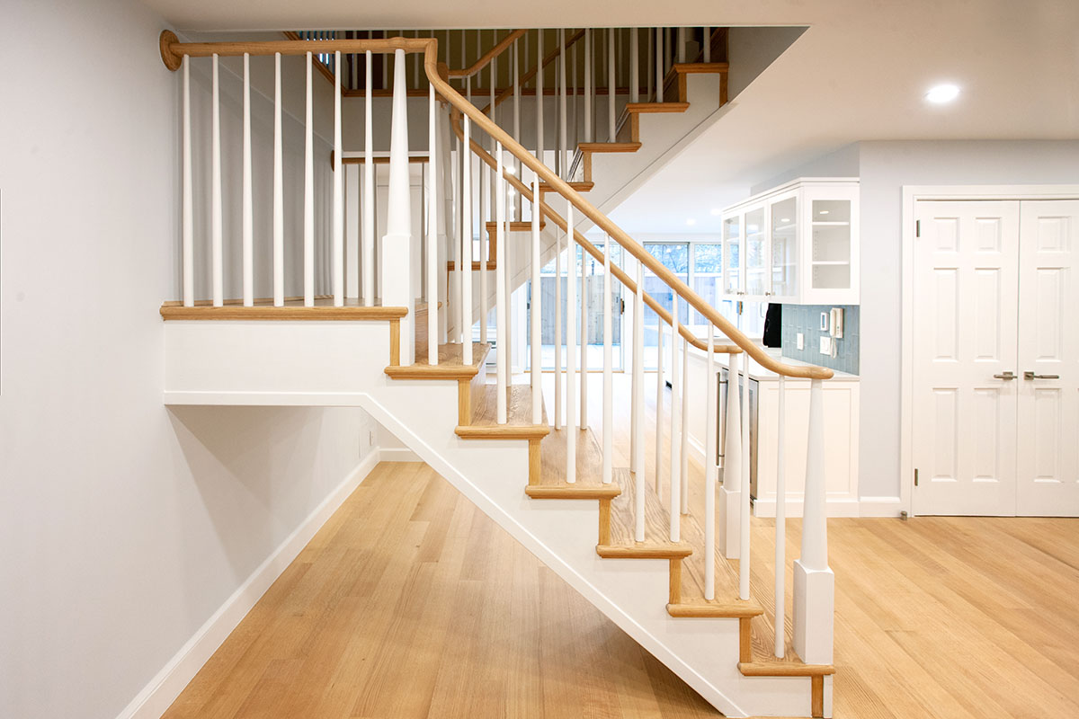A custom red oak Stairway Remodel in A Partial Contemporary Renovation on the Upper West Side